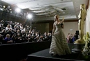Best Actress winner Reese Witherspoon poses backstage at the 78th annual Academy Awards in Hollywood March 5, 2006. Witherspoon won for her performance in 'Walk the Line.' REUTERS/Mike Blake